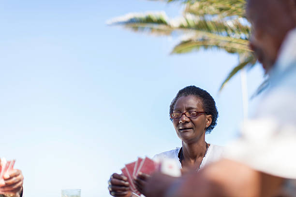 istock African senior playing a game of cards 481339291
