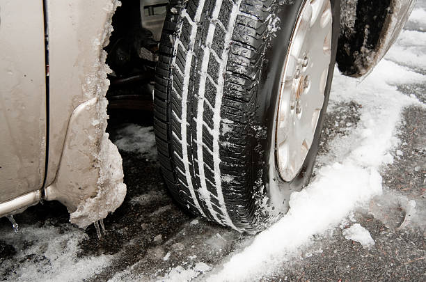 istock Car tire in snow and ice 481339893