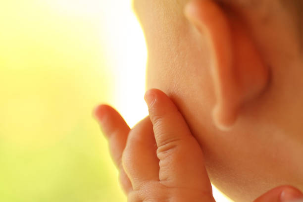fingers on the face stock photo