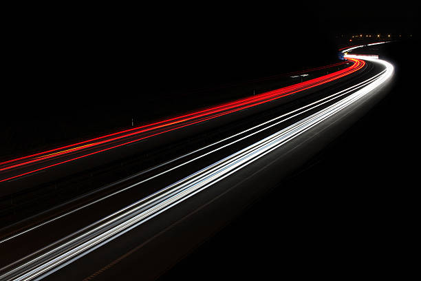 the car's light trails on the street long exposure the car's light trails on the street long exposure reflector stock pictures, royalty-free photos & images
