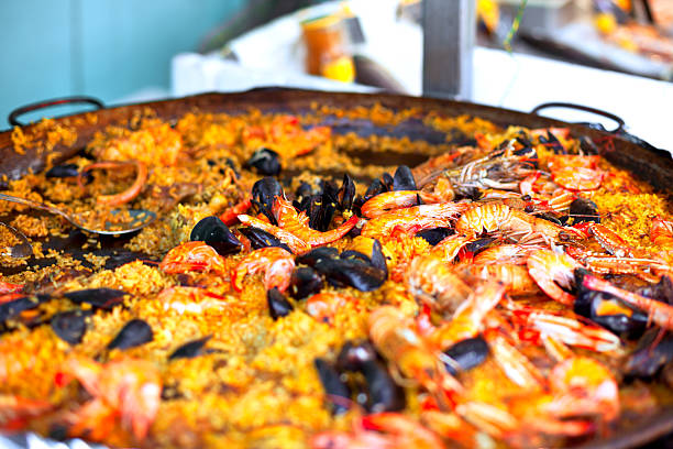 istock Traditional paella with seafood in a market 481349582