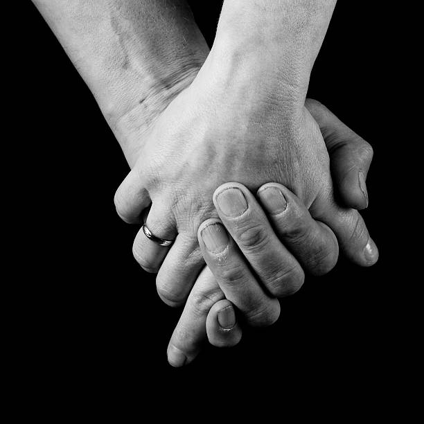 istock male and female holding hands 481349710