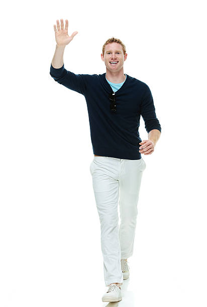 istock Smiling casual man waving hand 481349980