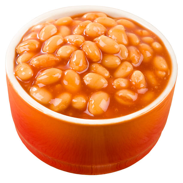Baked Beans Baked Beans - Bowl of baked beans in tomato sauce isolated on a white background. baked beans stock pictures, royalty-free photos & images