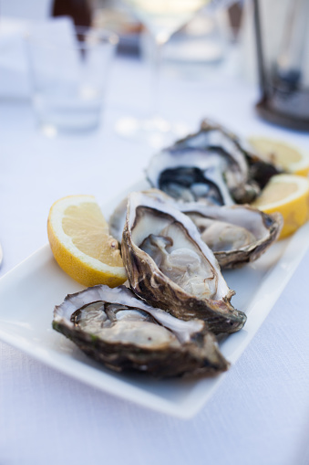 fresh oysters served with lemon slices