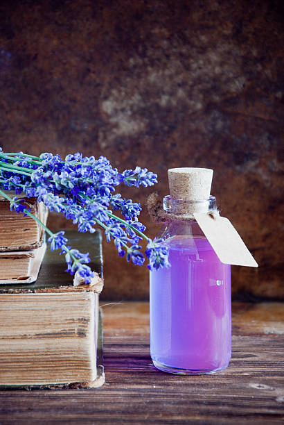 Lavender flowers, lavender essential and old books