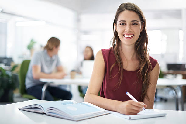 At college you really do learn something new everyday Portrait of a female student sitting with her books in a classroomhttp://195.154.178.81/DATA/i_collage/pu/shoots/805320.jpg adult education book stock pictures, royalty-free photos & images