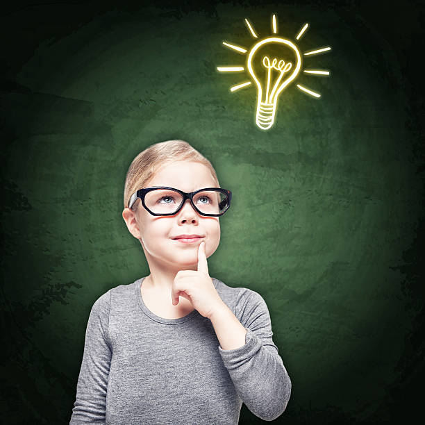 istock Smart beautiful little girl on the chalkboard background 481352076