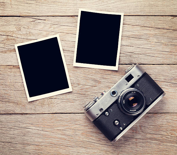 istock Vintage film camera and two blank photo frames 481354372