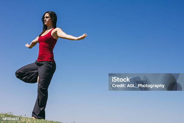 Woman Doing Yoga Outdoors Stock Photo - Download Image Now - 2015, Active Lifestyle, Adult