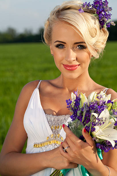 istock Beautiful bride blond blue eyes green field 481358022