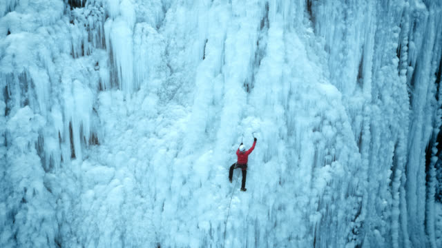 Approaching the ice climber in the steep slope