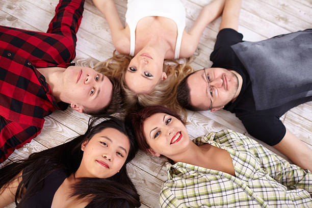 istock group of students relaxing on the bed 481358996