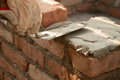 Man laying bricks