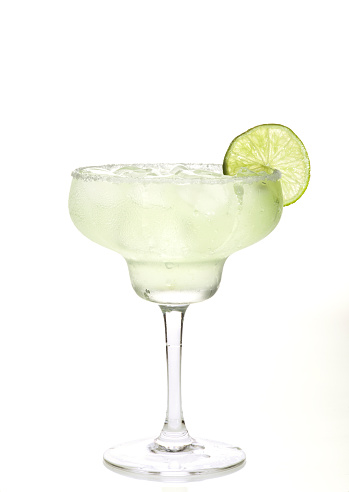 Glass of margarita cocktail on a white background.