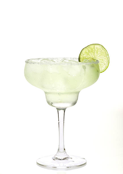 Margarita Cocktail Glass of margarita cocktail on a white background. margarita stock pictures, royalty-free photos & images
