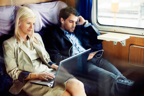 istock business people  on  passenger train relaxing 481362862