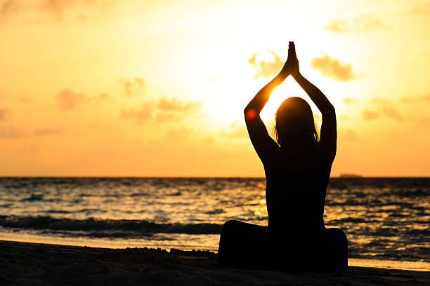 istock Woman meditation on the beach 481362988