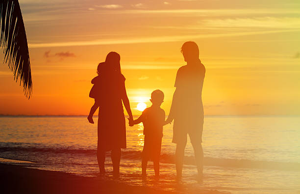 istock happy family with two kids on sunset beach 481363028
