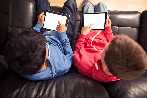 istock youth playing with technology indoors 481365602