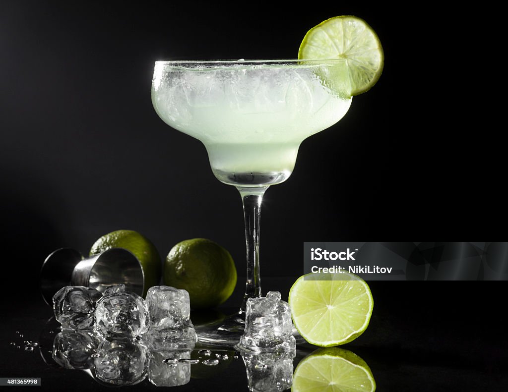 Margarita Cocktail Glass of margarita cocktail on a black background. 2015 Stock Photo