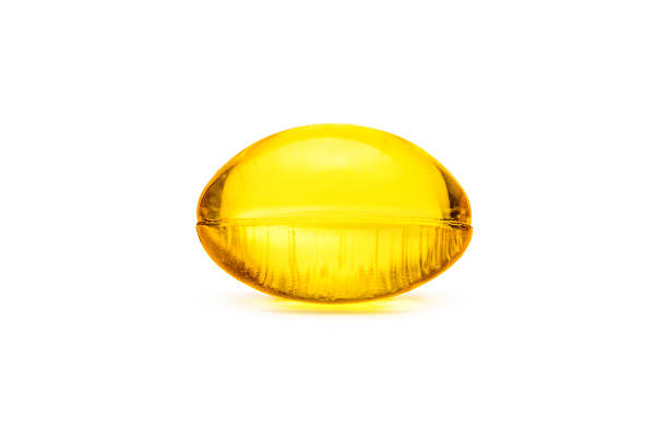 istock Fish oil capsule isolated on white background 481366602