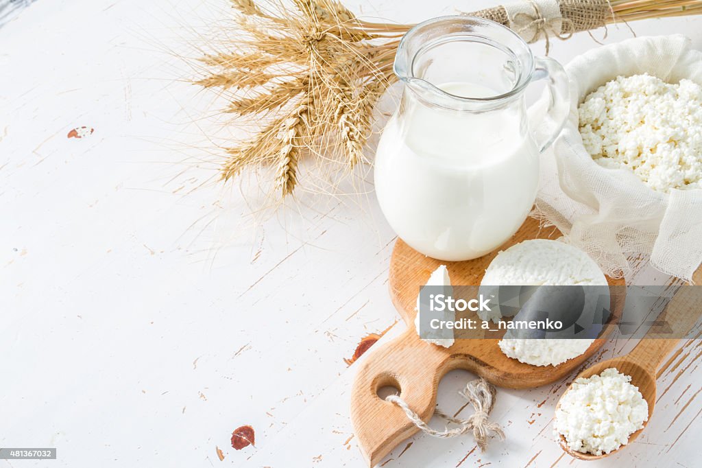 Fresh dairy products (milk, cottage cheese), wheat Fresh dairy products (milk, cottage cheese), wheat, white wood background Dairy Product Stock Photo