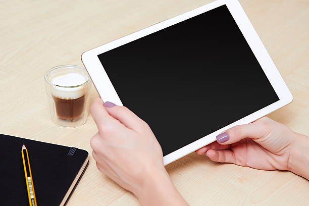 istock Girl looking at a digital tablet, with a coffee 481368442