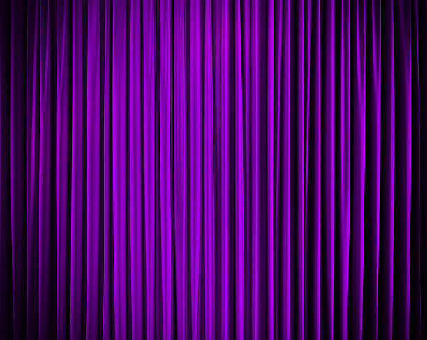 istock closed curtain with light spots in a theater 481370943