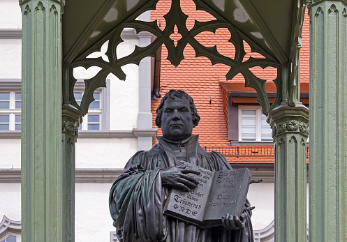 Monument of Martin Luther in Wittenberg, Germany. It was the first public monument of the great reformer, designed 1821 by Johann Gottfried Schadow. Martin Luther (1483-1546) was a German monk, theologian, and church reformer and the translator of the bible into German.