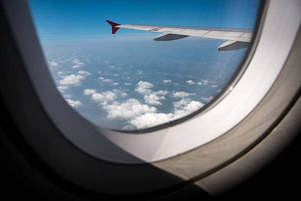 istock Airplane wing out of window 481380322