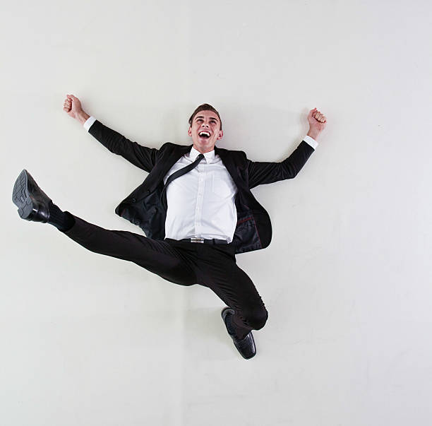 istock Happy businessman lying on floor 481381914