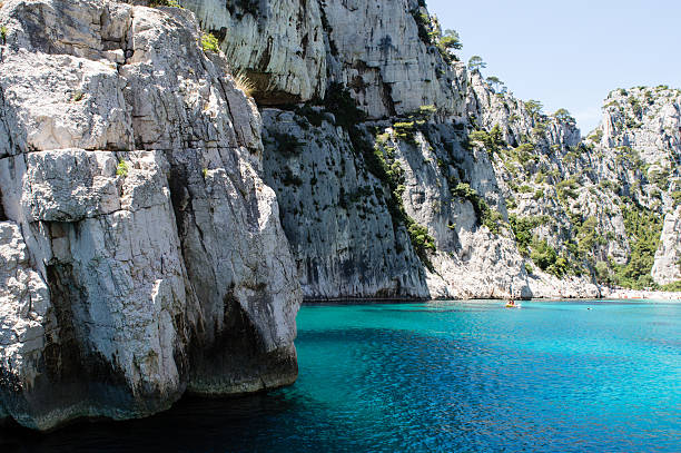 istock Strata rocks dipping into the sea 481381920