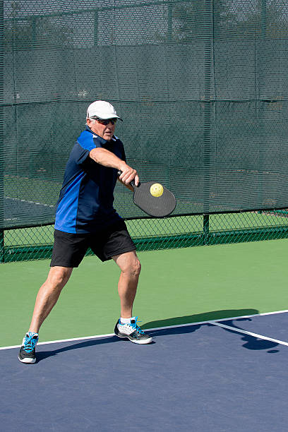 istock Pickleball Action - Senior Man Hitting Pickleball 481386624