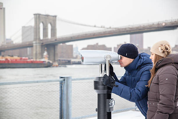 istock Young  man, tourist, looking to Manhattan with binocular 481387184