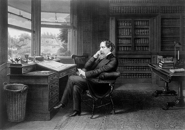 Charles Dickens in His Study This vintage image features Charles Dickens in his study. charles dickens stock pictures, royalty-free photos & images