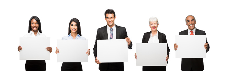Smiling Business executives with commercial signs isolated over white background