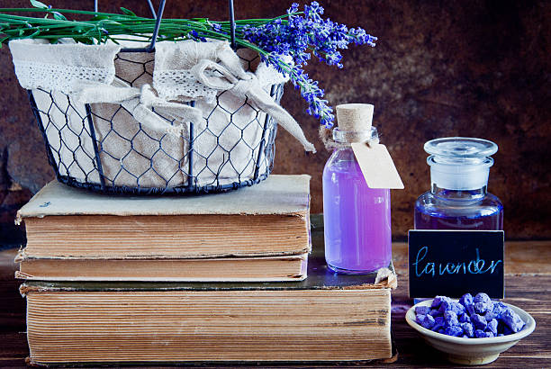 istock Lavender flowers, lavender essential and old books 481388516