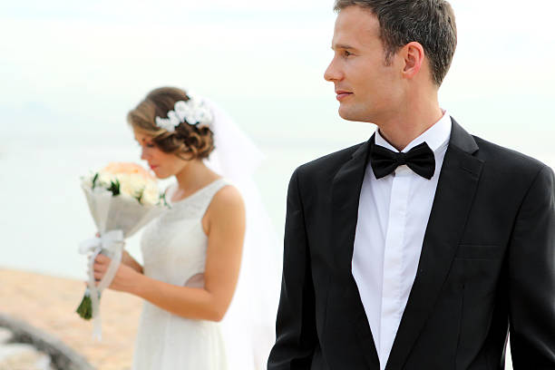 istock handsome groom and beautiful bride 481388644