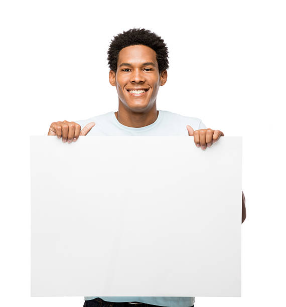 istock Young latin man holding white sign with both hands 481389261