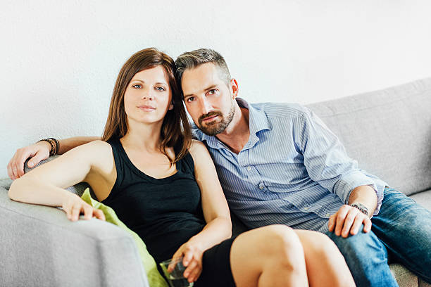 istock Happy young couple relaxing on couch 481391922