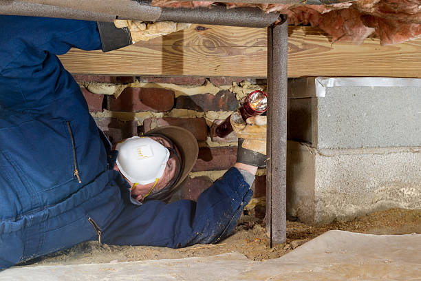 istock Home inspector examines a freeze protected crawl space water line. 481392445