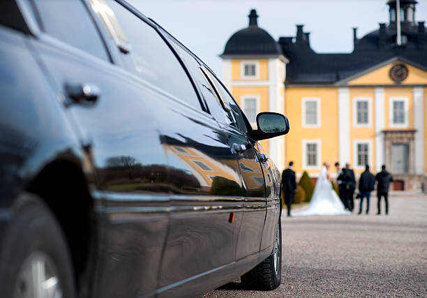 Limo at weeding Black limo waiting for bride and groom in front of mansion. Focus on reflection. palace photos stock pictures, royalty-free photos & images