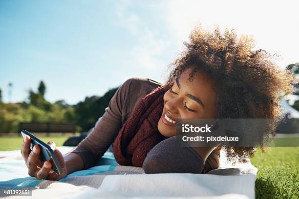 Sending Flirty Texts To My Love Stock Photo - Download Image Now - Females, Holding, Student