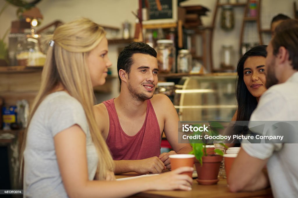 Good coffee is always best with great friends Shot of a group of friends chatting while having coffee at a cafehttp://195.154.178.81/DATA/i_collage/pu/shoots/805322.jpg 20-29 Years Stock Photo