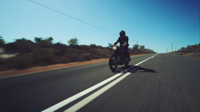Man driving on his motorcycle on highway