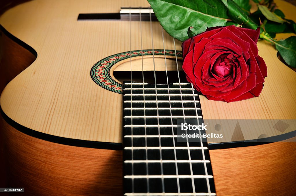 Classical guitar and rose. Classical guitar and red rose. 2015 Stock Photo