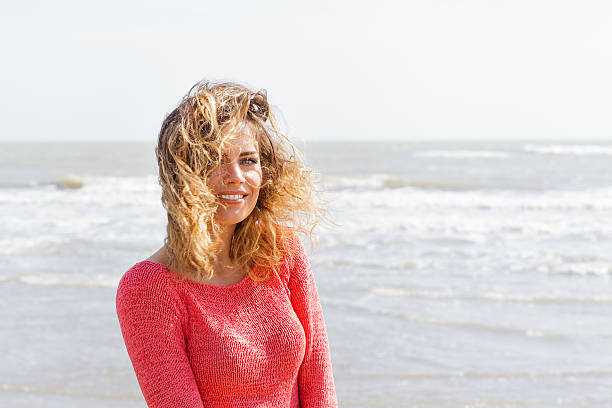 istock Smiling wind hair girl on the seaside 481401489