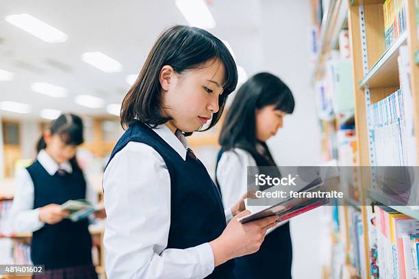 Japanese Female Students Reading In The Library Stock Photo - Download Image Now - High School Student, Manga Style, Japan