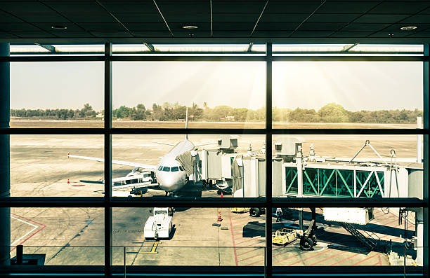 istock Modern airport with airplane at the terminal gate 481404329